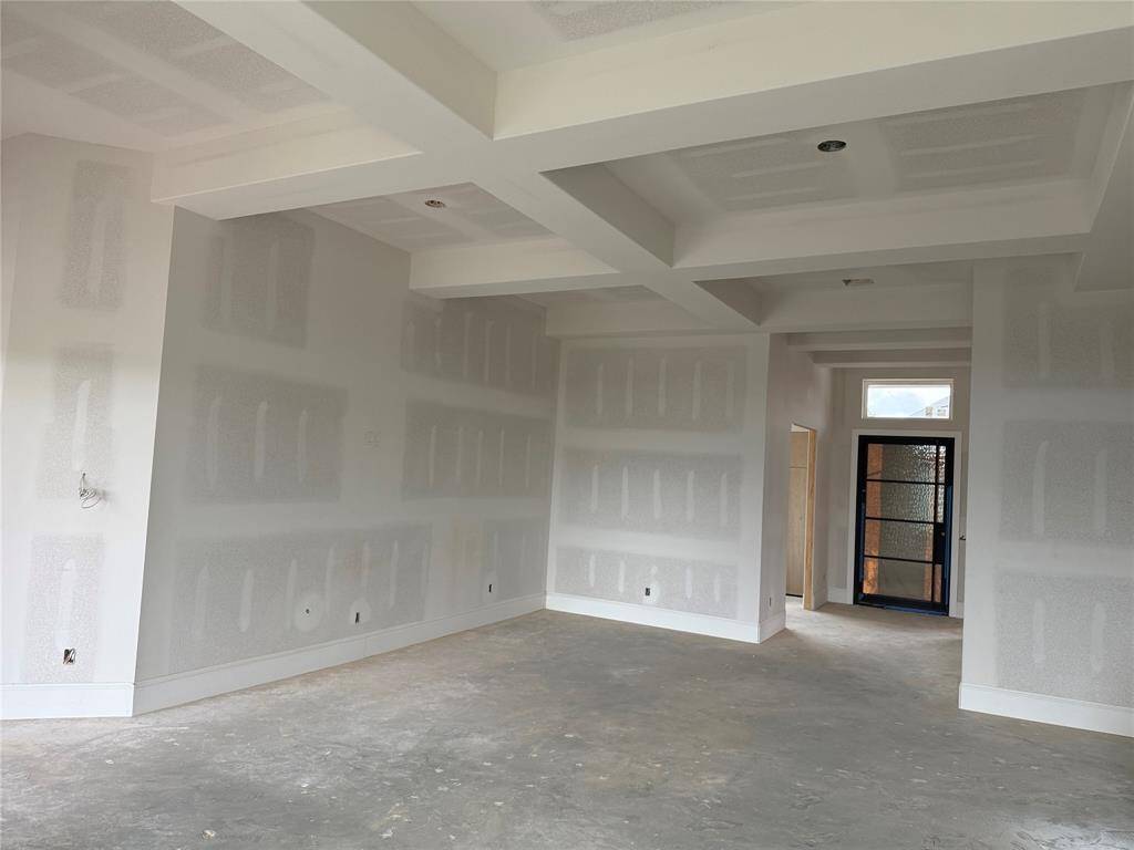 View of living room and stunning front door!