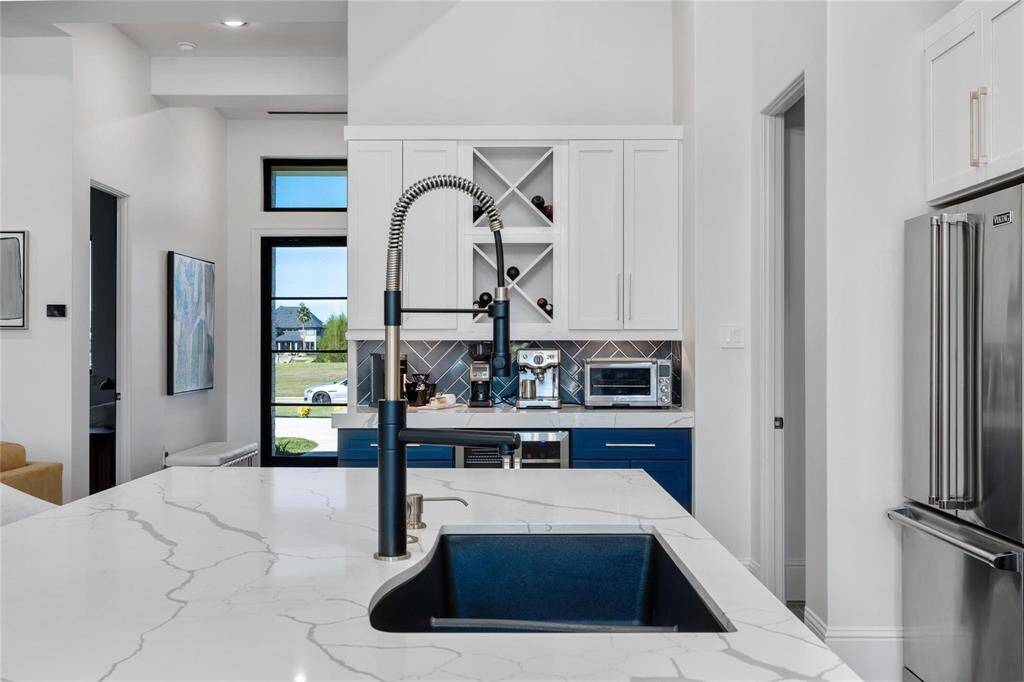 Model Home kitchen island with view of front door