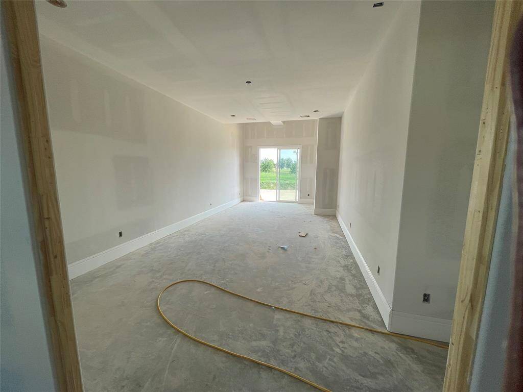 Current home view of primary bedroom with sitting area!