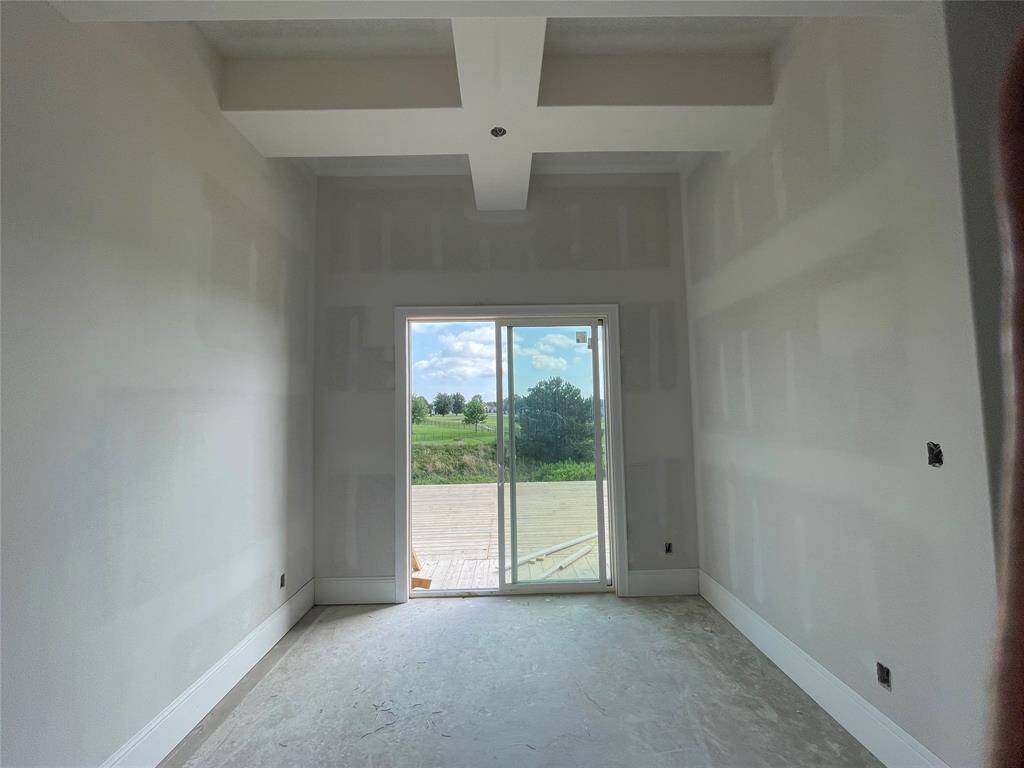 Primary bvedroom sitting area with sliding door to back deck.