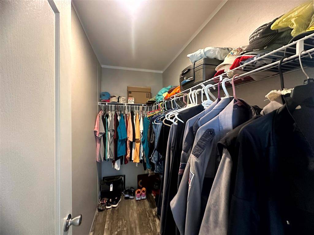The walk in closet has plenty of storage