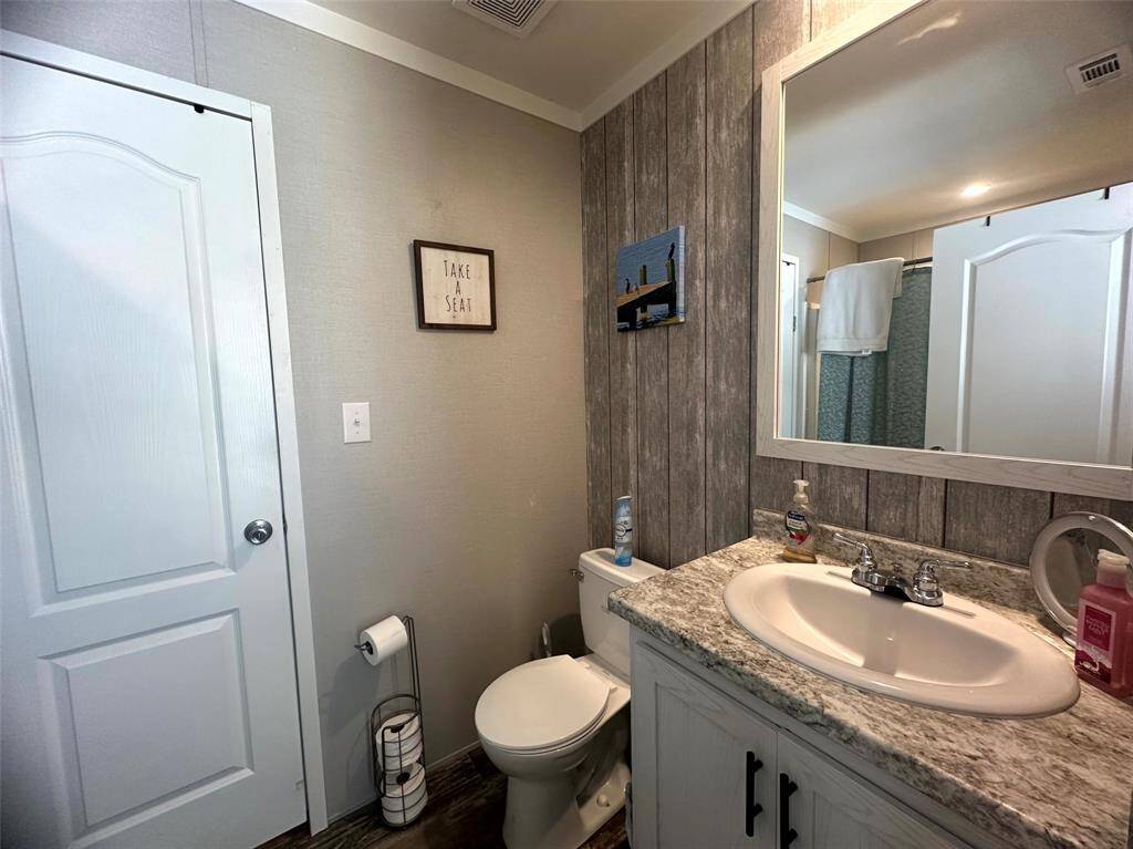 The guest bath is light and bright as well