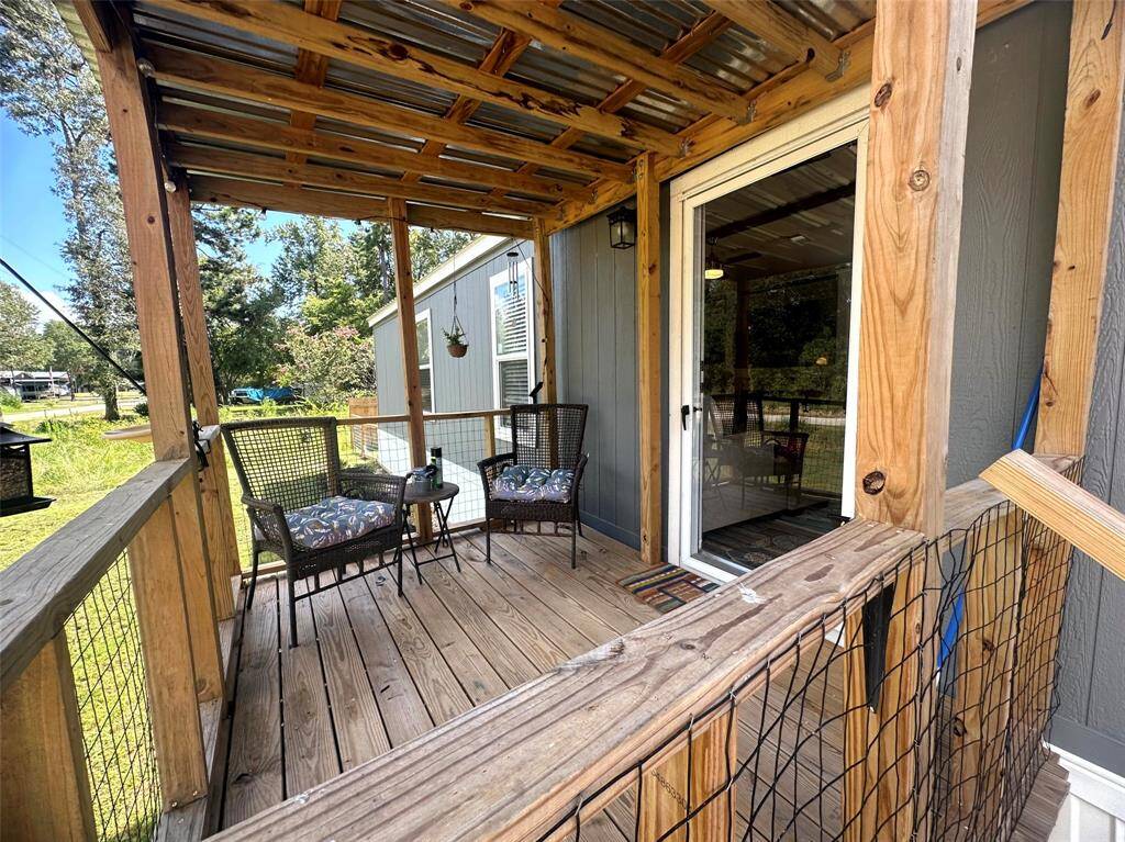 The covered patio and deck is great for relaxing and greets friends and family warmly!