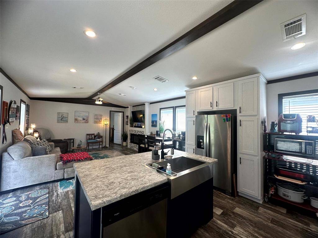 The living area is open to the sleek and modern kitchen, so you stay connected to your friends and family!
