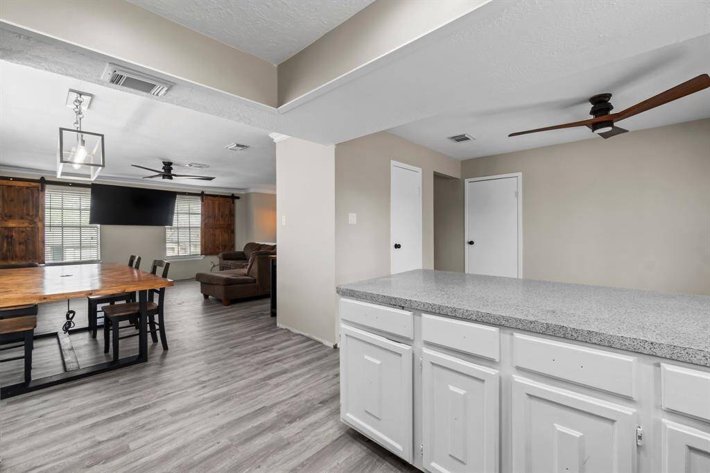 This open kitchen offers a breakfast bar.
