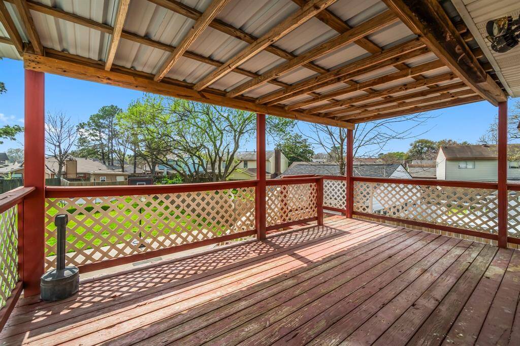 Access to this covered deck off of the breakfast room with views of the large backyard.