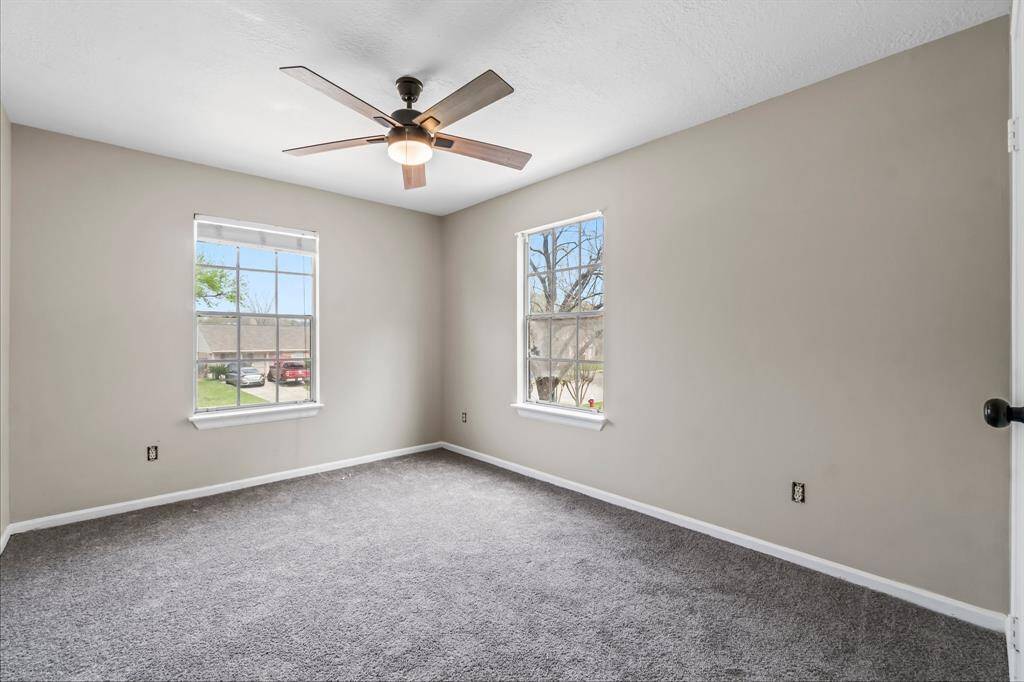 Another large secondary bedroom overlooking the front yard.