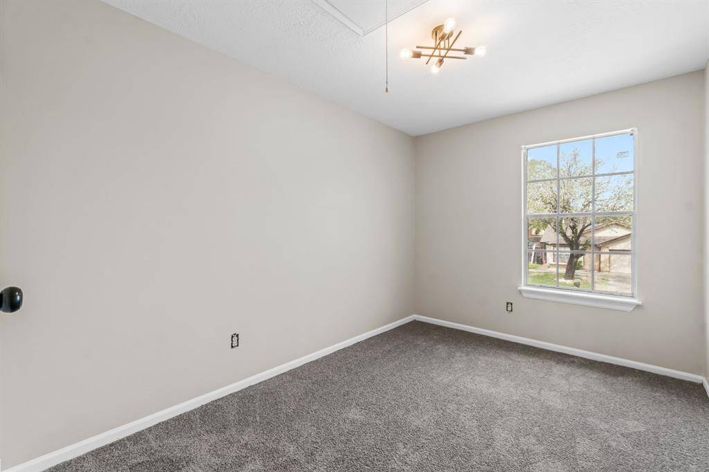 Another bedroom with new carpet and paint plus upgraded light fixture.