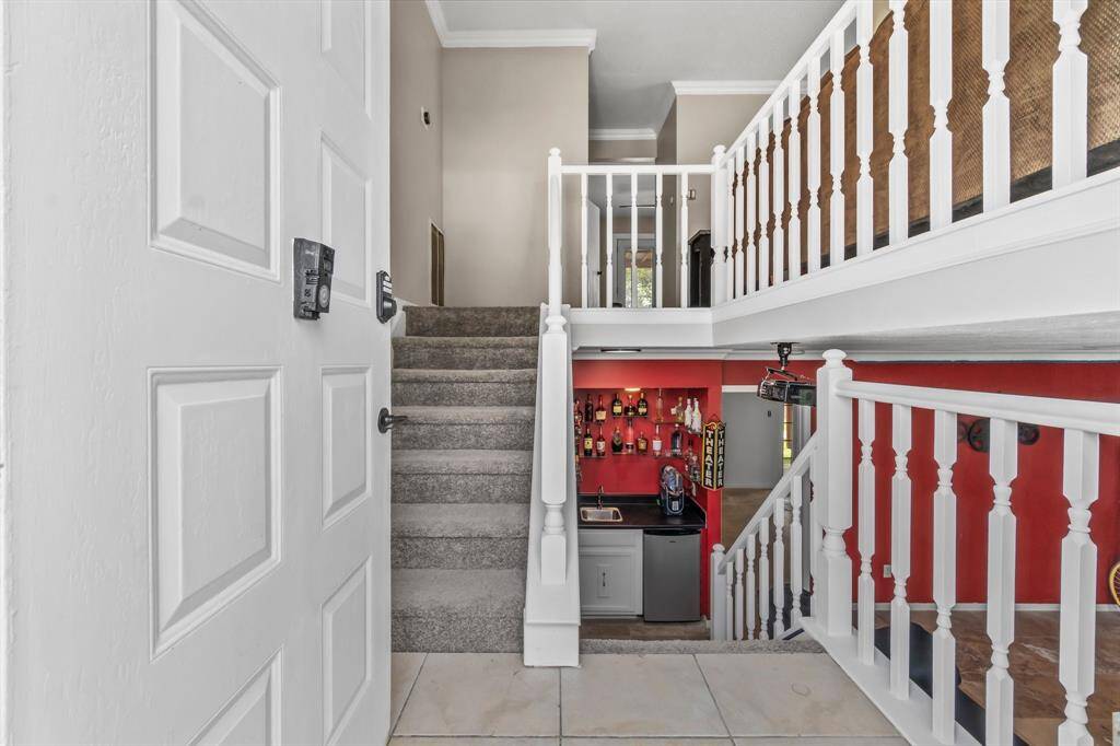 This split level home offers a private theatre room and primary suite on the bottom level, and living quarters on the top!