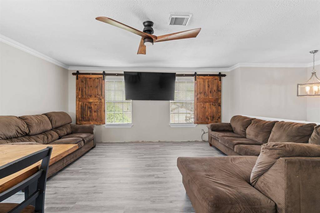 Custom window coverings and updated ceiling fan. Please note baseboards will be completed.