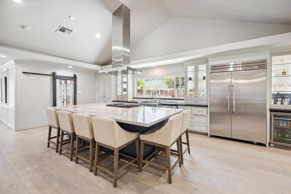 The Kitchen is smashing, and will inspire even the most tepid to create culinary masterpieces. The Kitchen features Thermador appliances, lighted, glass front Cabinets and an Breakfast Bar that will seat six.