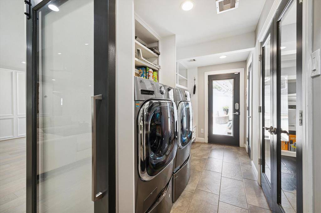 Just beyond the Kitchen is the Mud Room/Laundry Room with tile floors and access to the Back Yard and Pool.