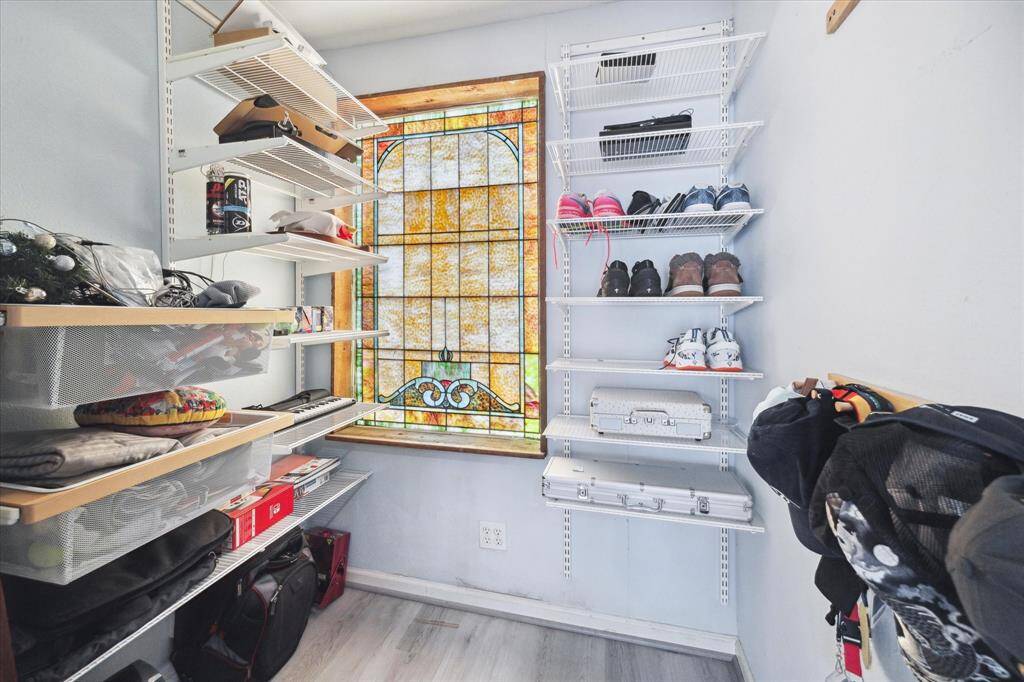 The Casita features a spacious walk in closet with a vintage stained glass window.