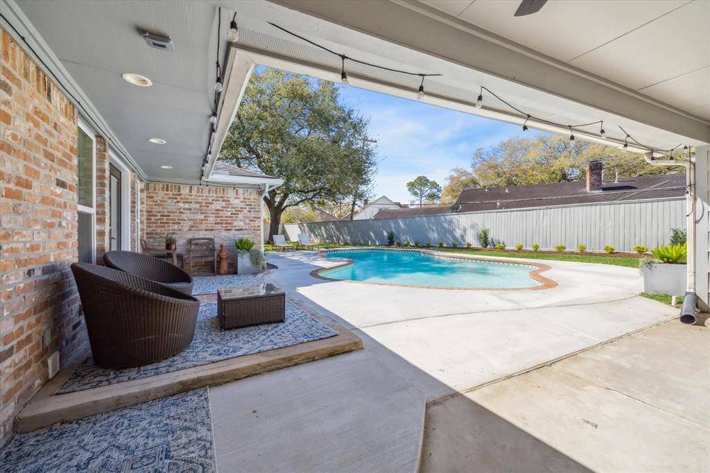With Summer approaching, wouldn't it be nice to have your own private back yard resort? For you with the porcelain skin, you may sit in the shade and watch the action for your covered Patio.