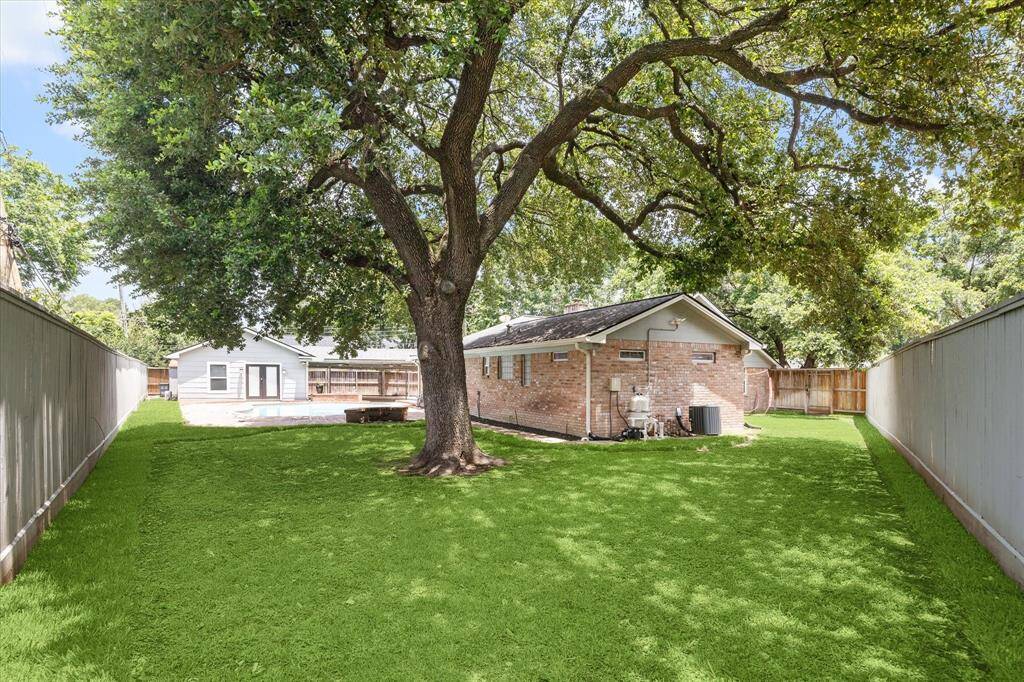 This 15,000+ square foot lot affords you all kinds of play space and garden space. With plenty of room for unchecked zoomies, your dogs will thank you for buying this home!
