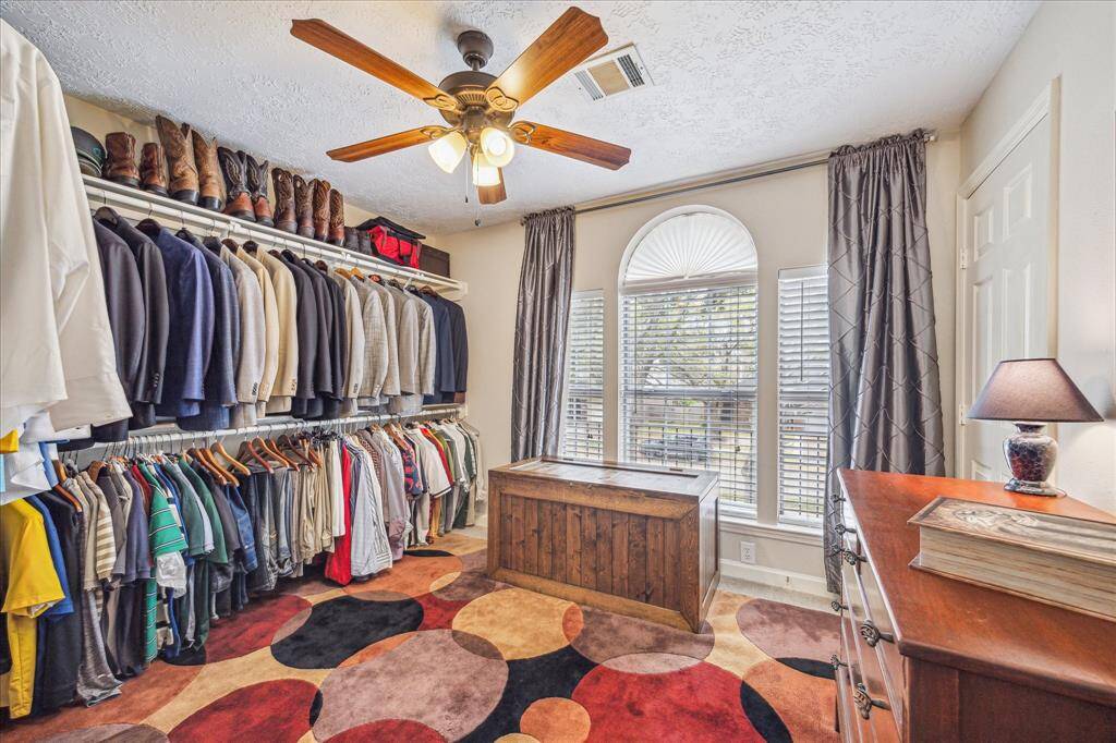 In addition to the large walk-in closet in the primary bath, one of the secondary bedrooms is being utilized as a closet.
