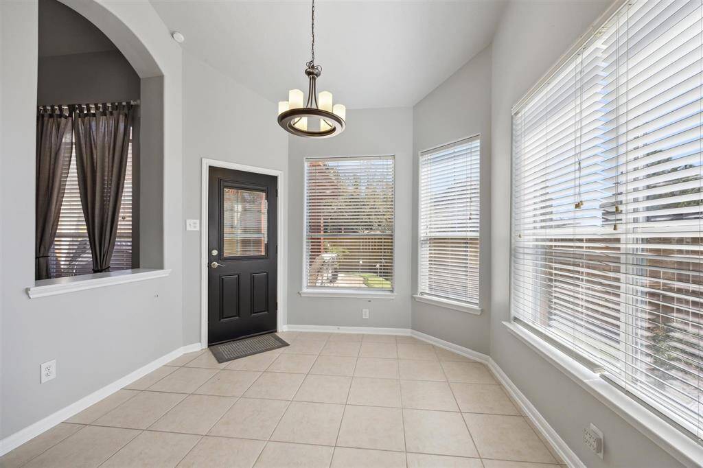 The breakfast room is right next to the kitchen, and the family room is just to the left.  Just wait until you see the outdoor oasis!!