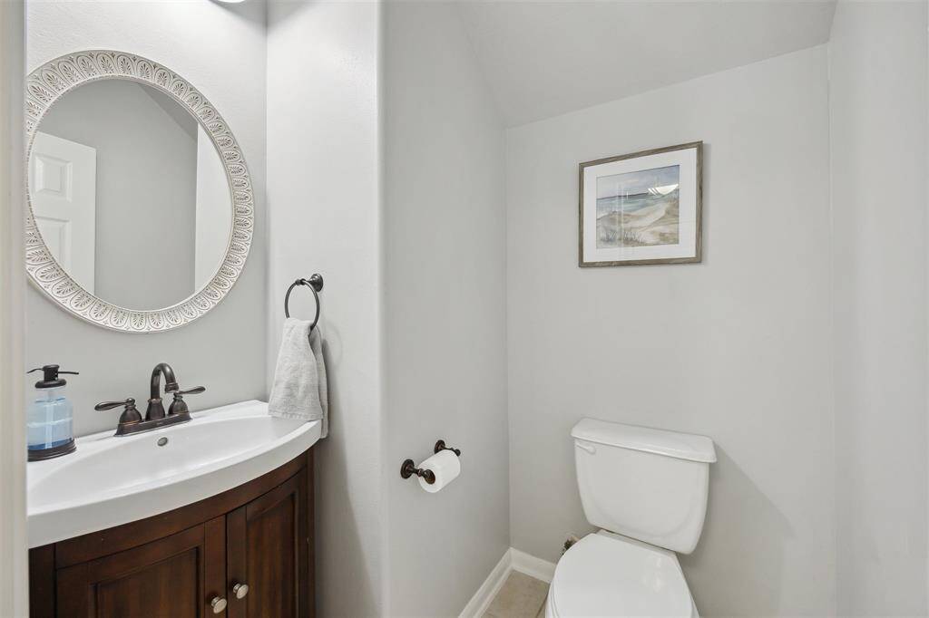 The half bath is on the first floor close to the door to the garage - tucked away.