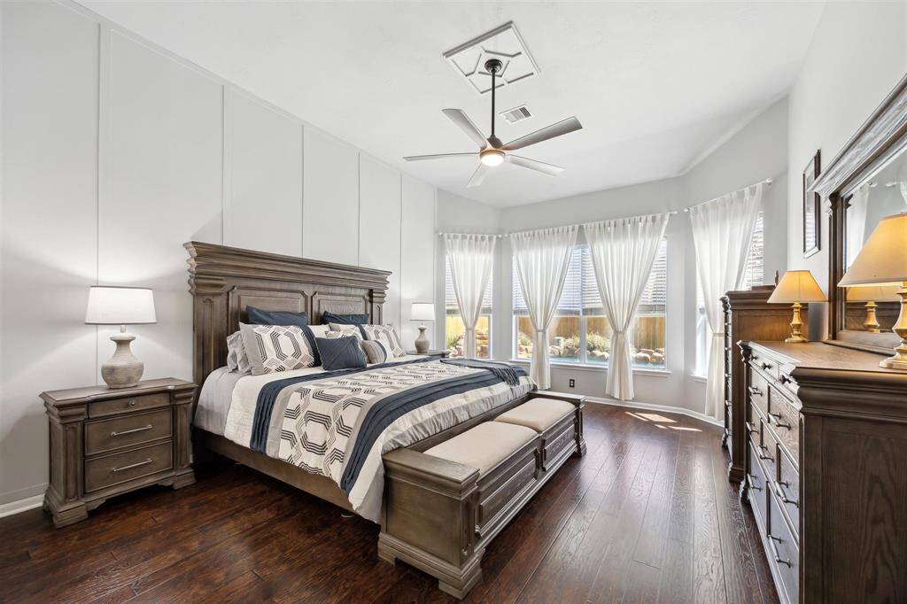 Now to the primary retreat!  This room is huge at 18' x 14'!  The wall of windows looks out to the pool, outdoor kitchen, putting green and more!