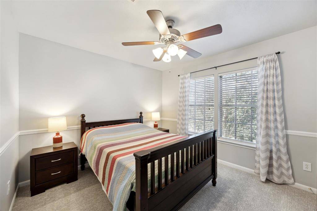 The second of the 3  bedrooms upstairs.  The windows looks out to the front, and you can see the great oak tree out the window.  The closet is off to the right.  All of the upstairs bedroom closets have had lights installed in them.