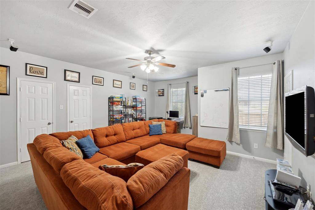 The game room!  It's huge at 21' x 17'.  Two closets to store games, little nock could be for a desk, window looks out to the front yard.