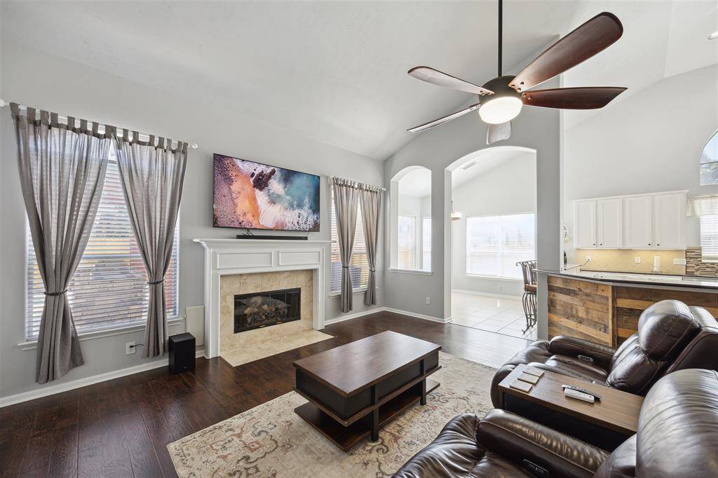The family room is 21' x 17' and is open from the kitchen and breakfast room. More of the beautiful wood laminate flooring, arch walk through to the breakfast room, ceiling fan & gas log fireplace.