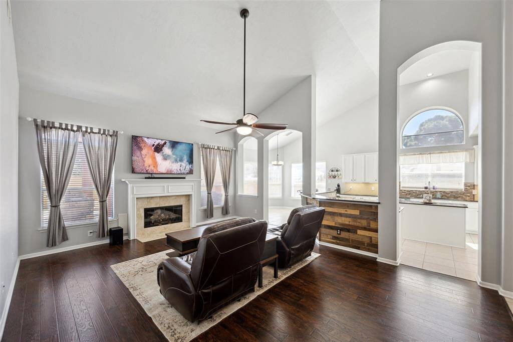 And a view of the family room where you can see another entrance to the kitchen.  Windows galore!