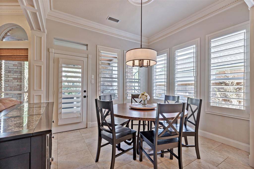Breakfast nook is a great place to gather and is just steps away from the covered outdoor living area and the pool!
