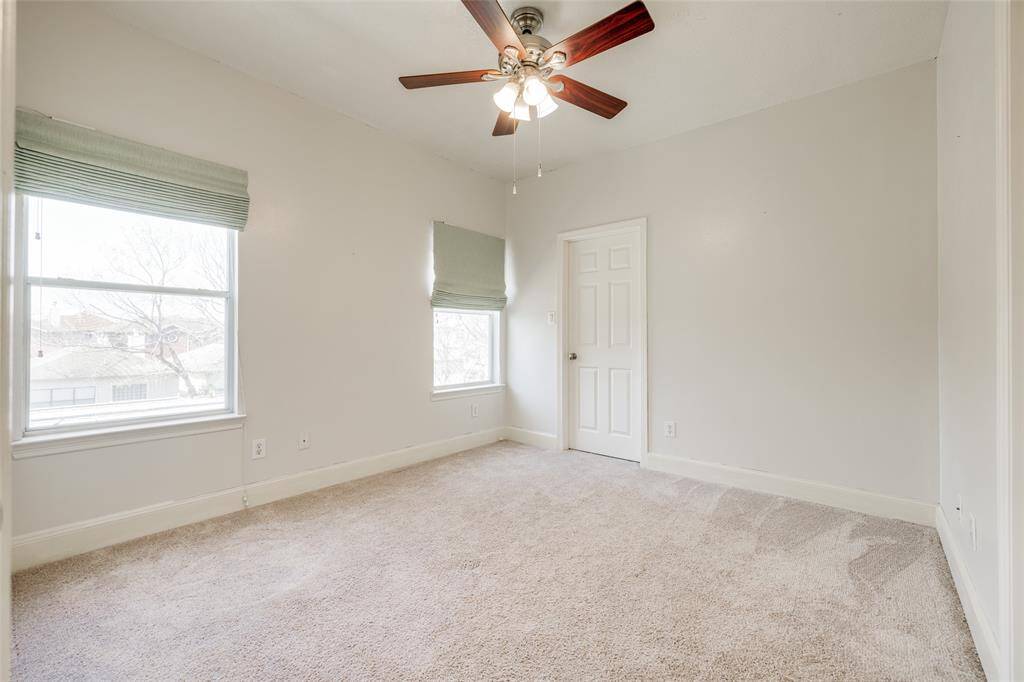 Secondary bedroom has plenty of natural light and private bath.