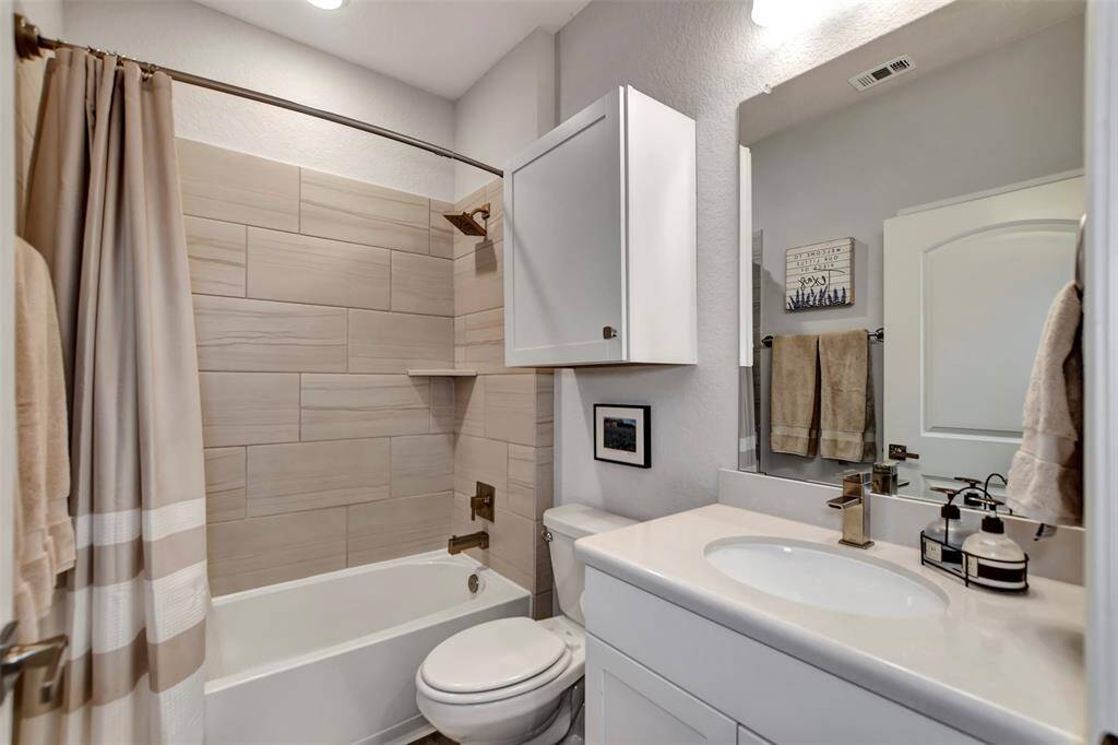 Guest Bath with newly added cabinet for extra storage.