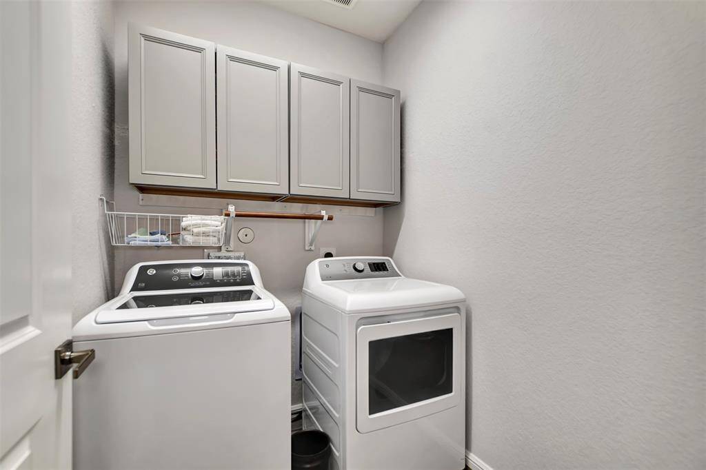 Laundry room with newly built cabinets