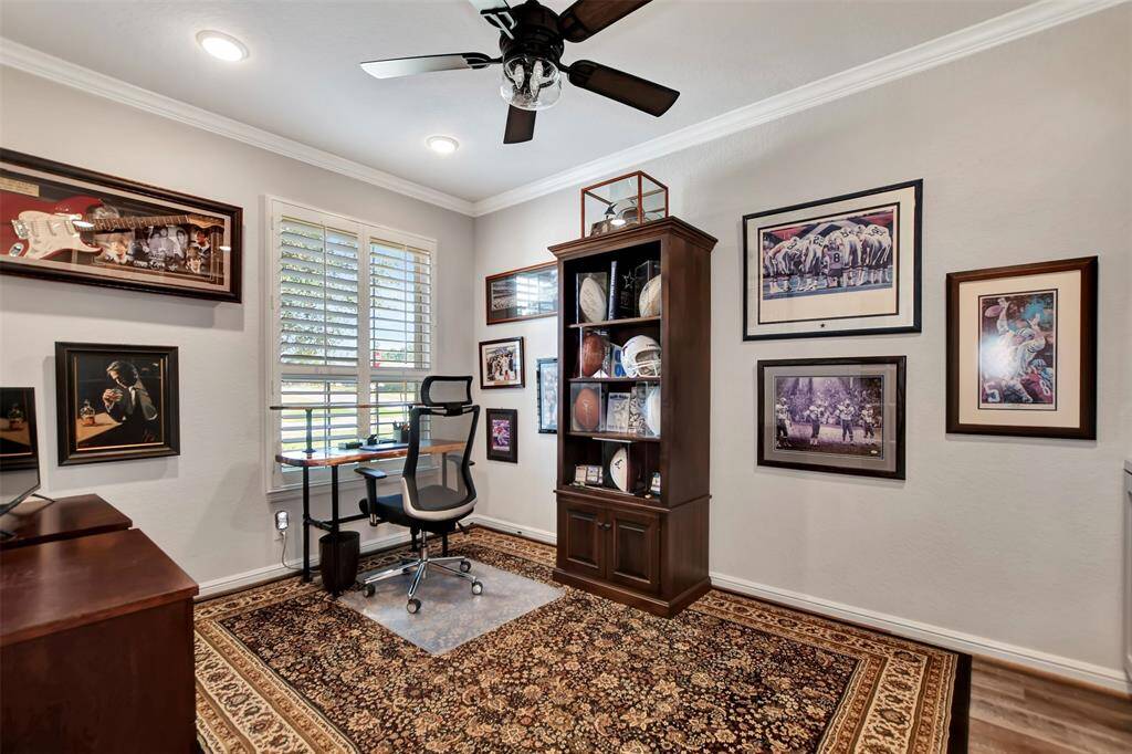 Study with french doors and cutom built in bookshelf.