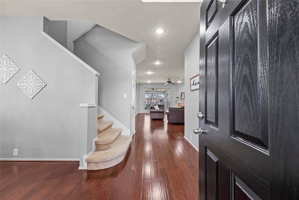 Hardwood floors invite you into the home and continue into the living room.