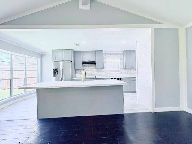 Large kitchen island, with plenty of room for counter height seating.