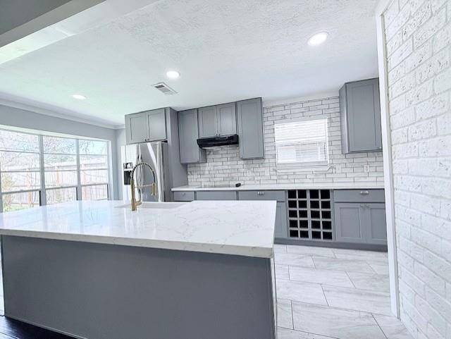 Lots of cabinet space, complete with a beautiful wine rack.