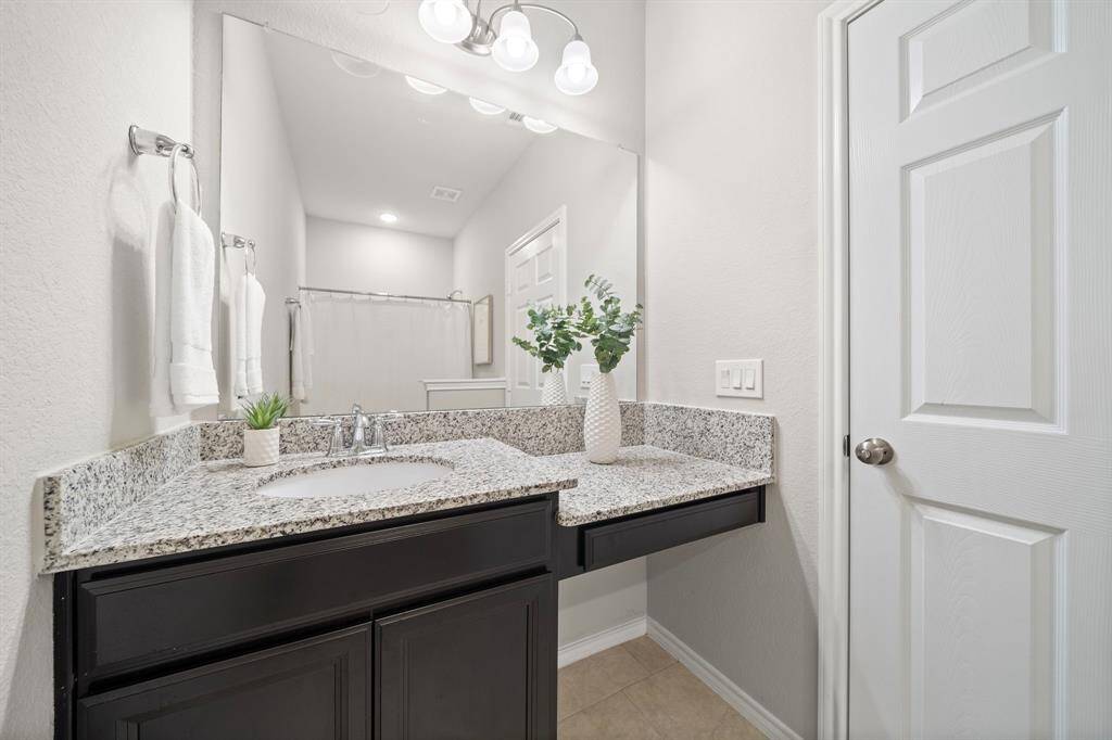 The guest bath on the first floor provides you with a vanity area in action to the sink.
