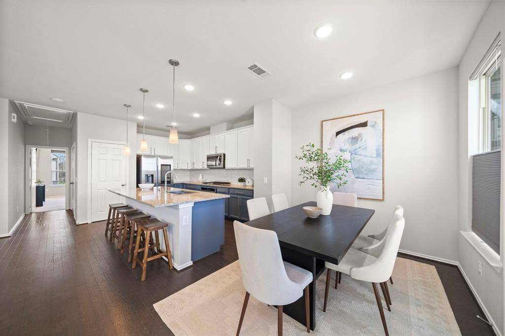 The dining area has great space and can accommodate a full size table!