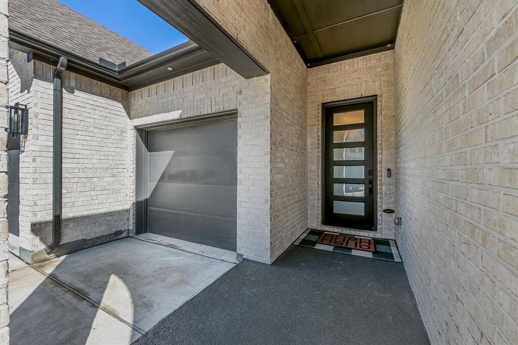 The inviting porch provides a perfect space to relax and enjoy the outdoors, offering a welcoming spot to unwind or greet guests.