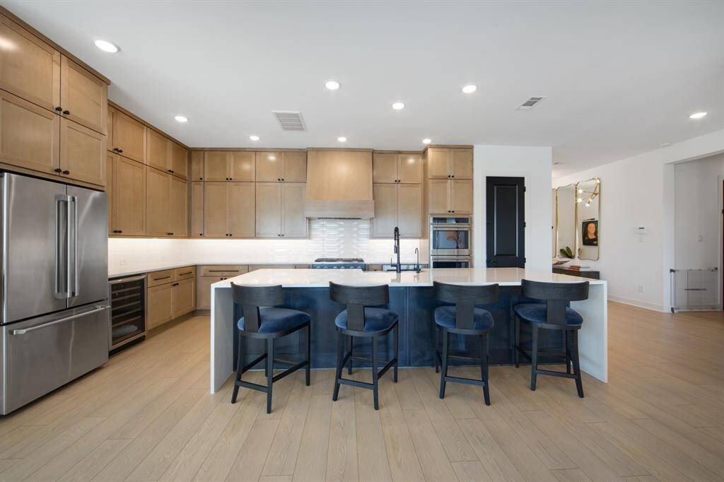The kitchen is equipped with a built-in wine fridge, perfect for storing and showcasing your favorite bottles. Every cabinet is fitted with soft-close hinges, offering a quiet, smooth, and elegant closure with every use.