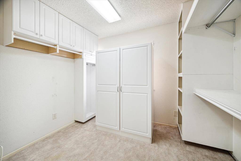 3rd bedroom was coverted to this Oversized Primary closet.  This could be converted back to a 3rd bedroom.