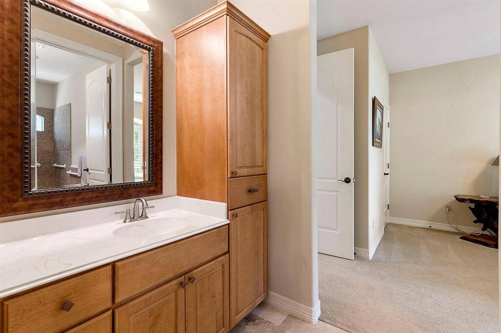 Single vanity on one side and across your private shower/water closet.