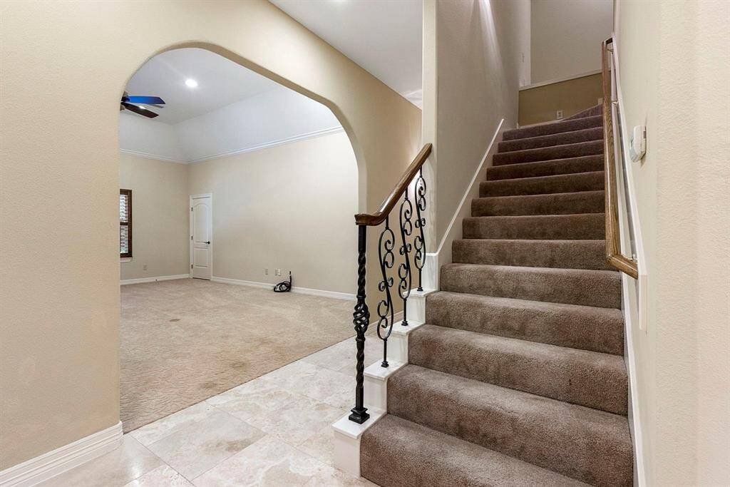 Game room/Den to left of stairs.  The size of this room gives you limitless ideas.  I would have a pool table, round game table, and comfy lounge area!
