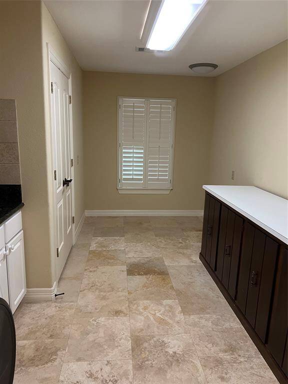 Storage closet on the left. Great space for crafting.