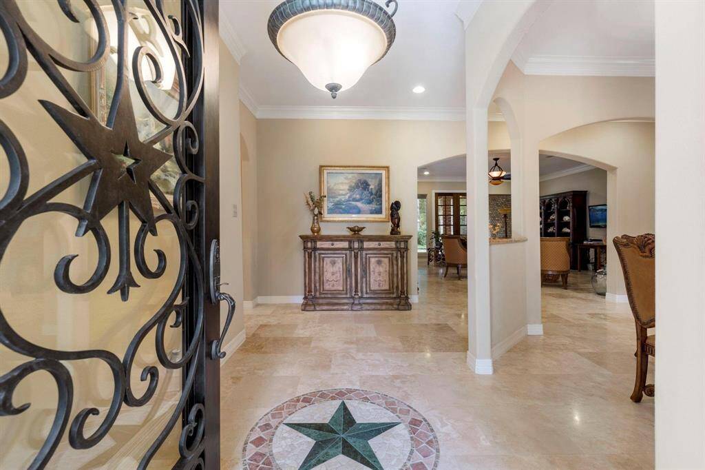 Beautiful wrought iron and glass entry door.