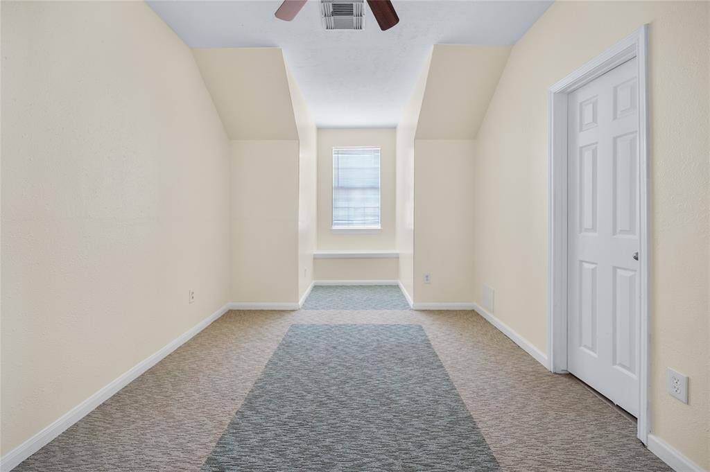 Bedroom 2 offer a chill window reading corner and ceiling fan.