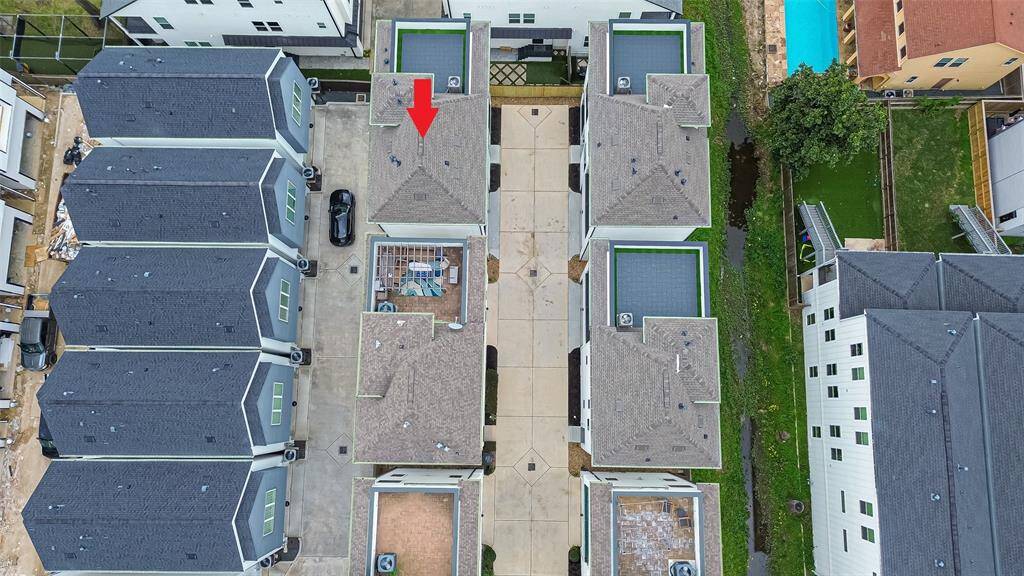 Explore modern townhouse living in this well-maintained complex, featuring elegant architecture and a shared driveway, fostering a strong sense of community.
