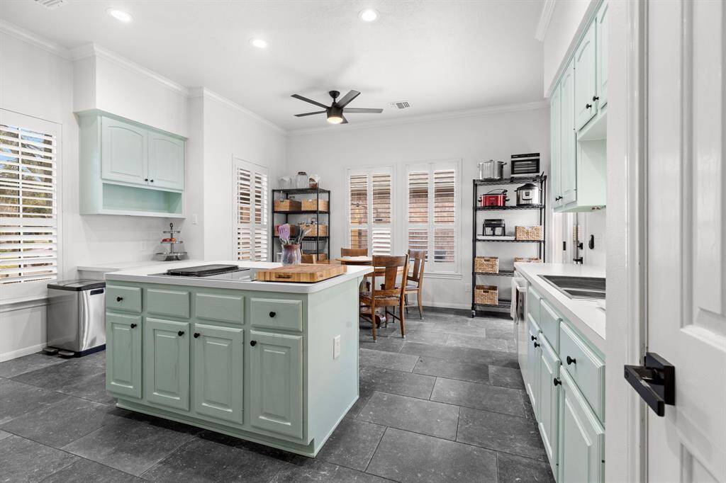Island Kitchen is nice and bright with high ceilings, recessed lighting, tons of nice big windows with custom plantation shutters.  New hardware and SS farmers sink.
