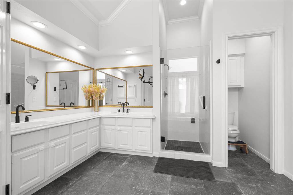 Double sinks , remodeled shower, recessed lighting and nice vaulted ceilings.  Walk in closets.