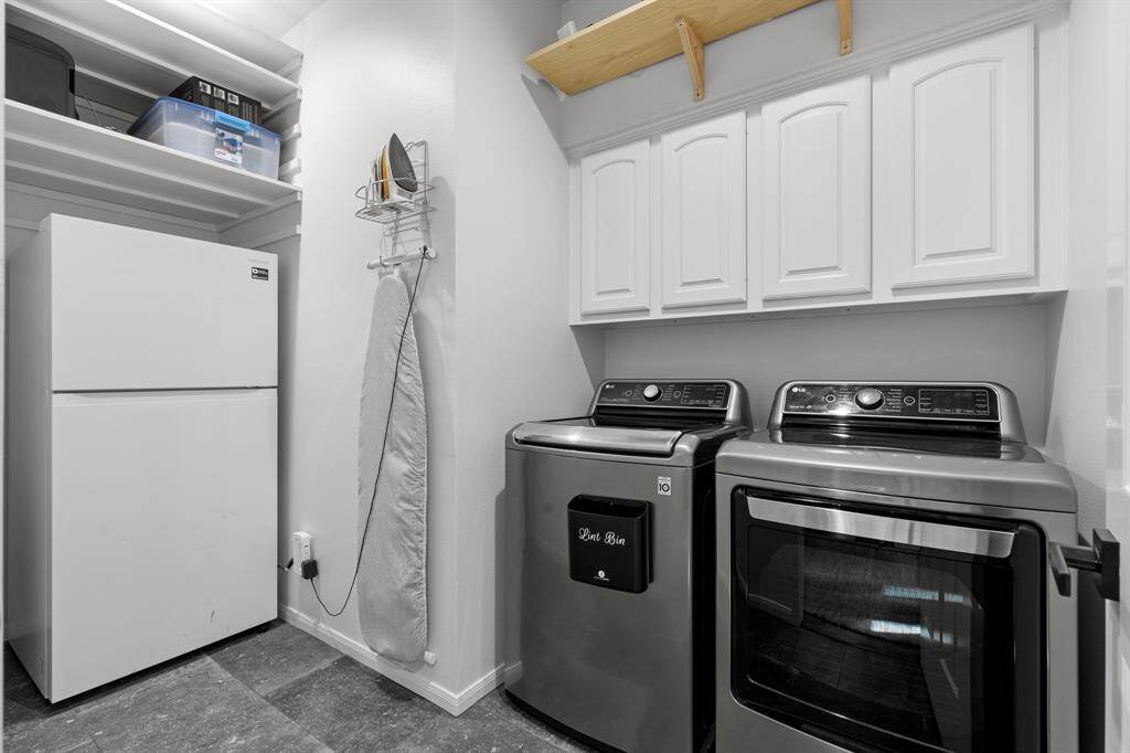 Nice big laundry room with plenty of room for an extra refrigerator !