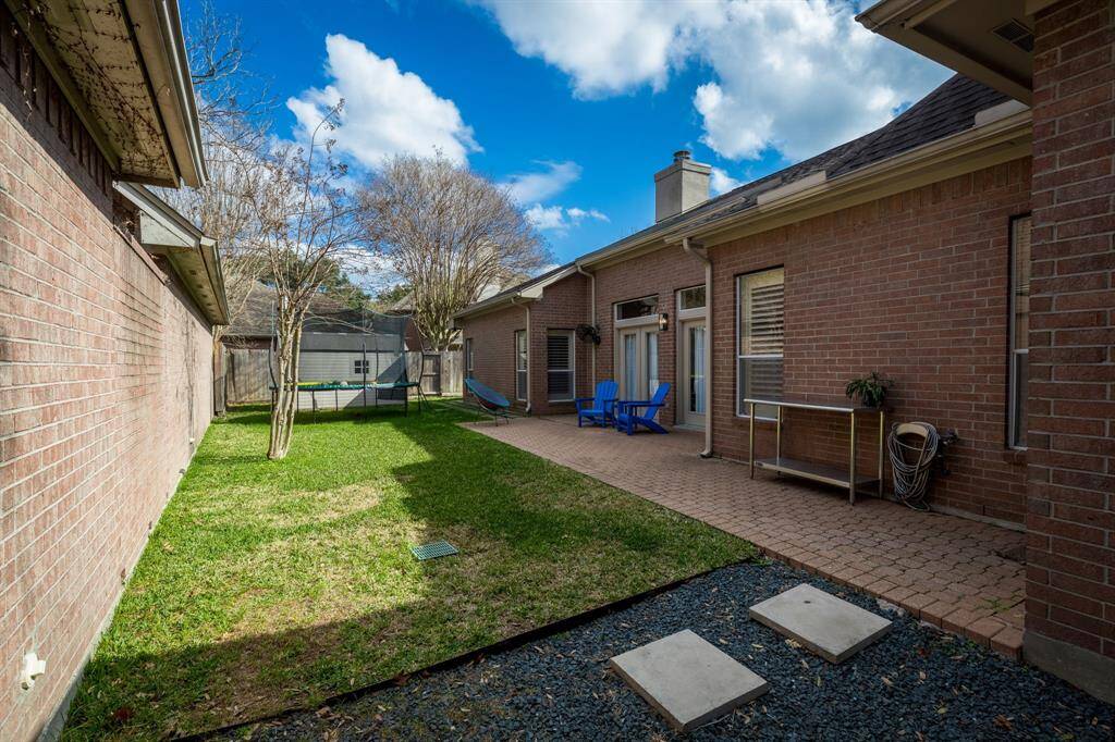 Nice big back yard with pave stone patio.  Home has gutter guards.